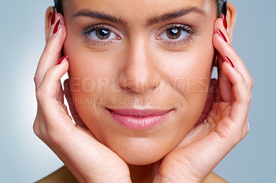 Buy stock photo Detail shot of a beautiful young woman with hands on chin against colored background