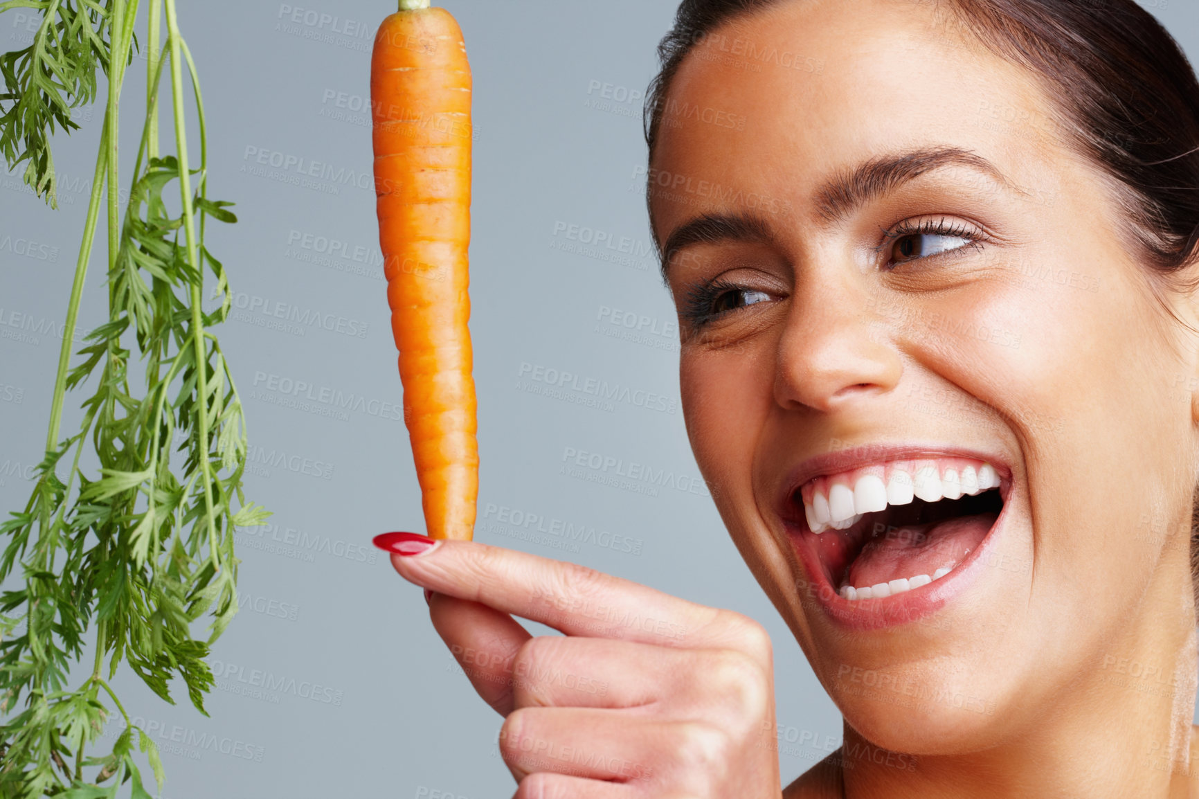 Buy stock photo Woman, laughing and skincare with carrot in studio background and satisfied with vegetable. Natural, beauty and happy with confidence for skin treatment, ingredient and glow with progress and organic