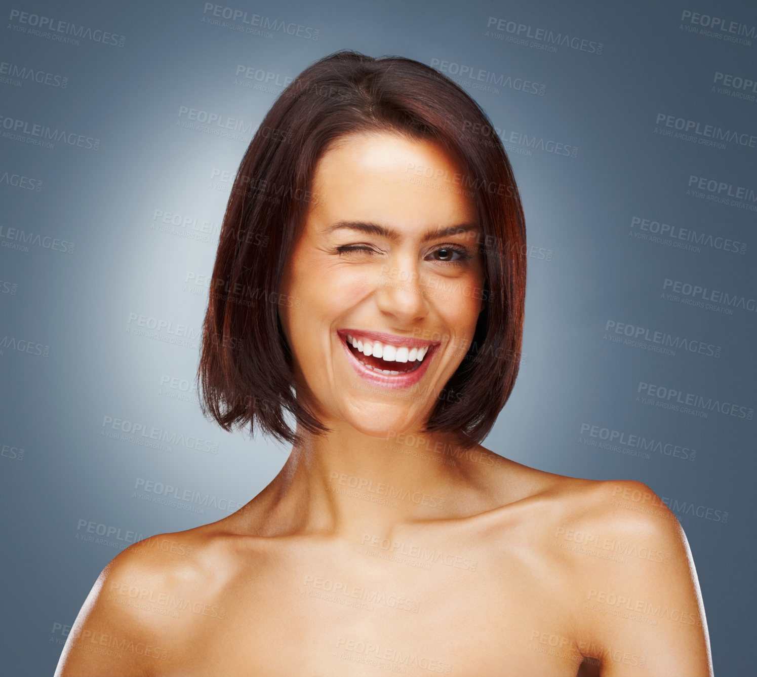 Buy stock photo Closeup portrait of a cheerful naked woman giving you a winking smile