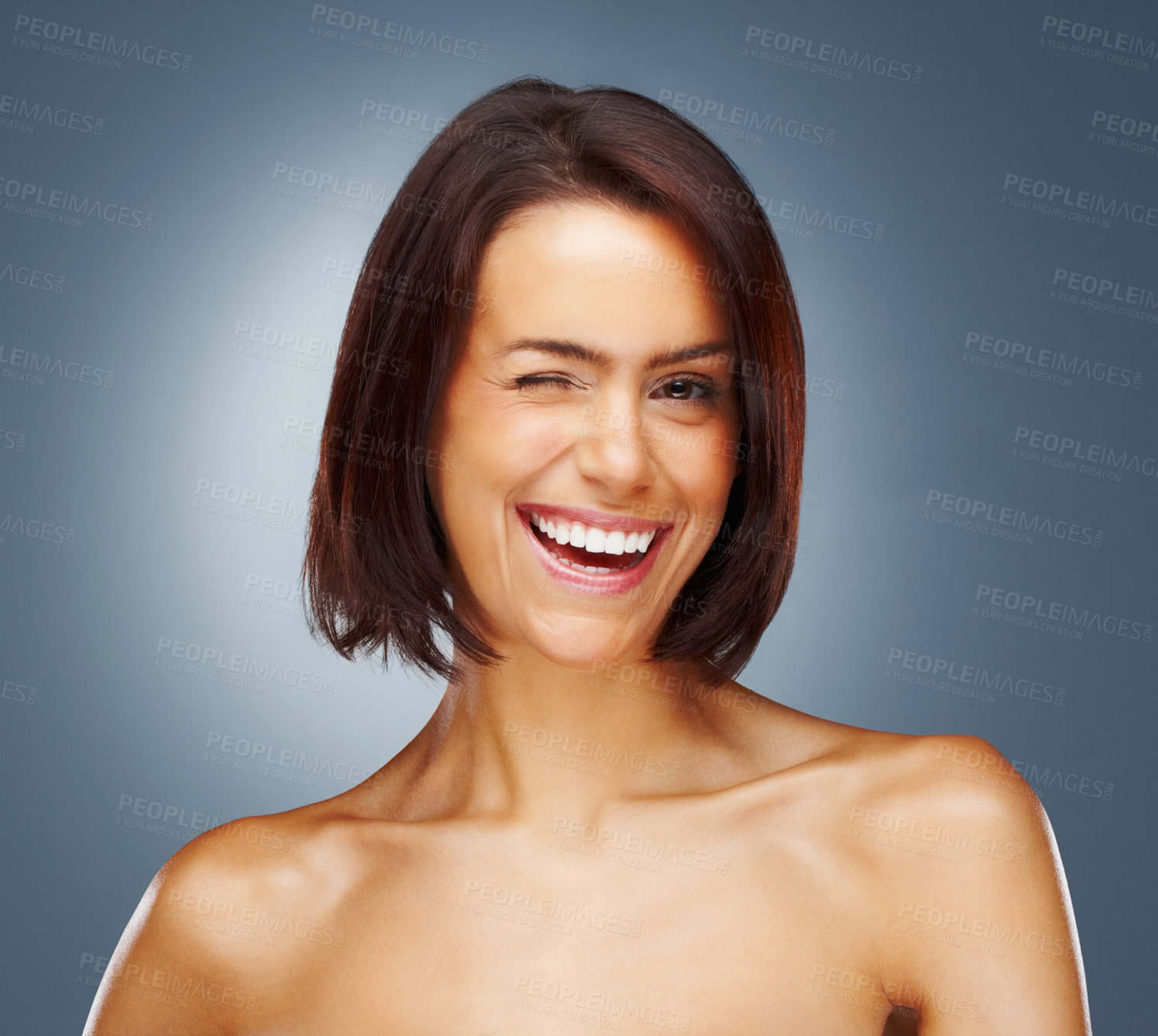 Buy stock photo Hair care, beauty or happy woman with wink, portrait or style for confidence, results or keratin treatment. Face, flirting or model in studio on grey background for wellness or natural growth shampoo