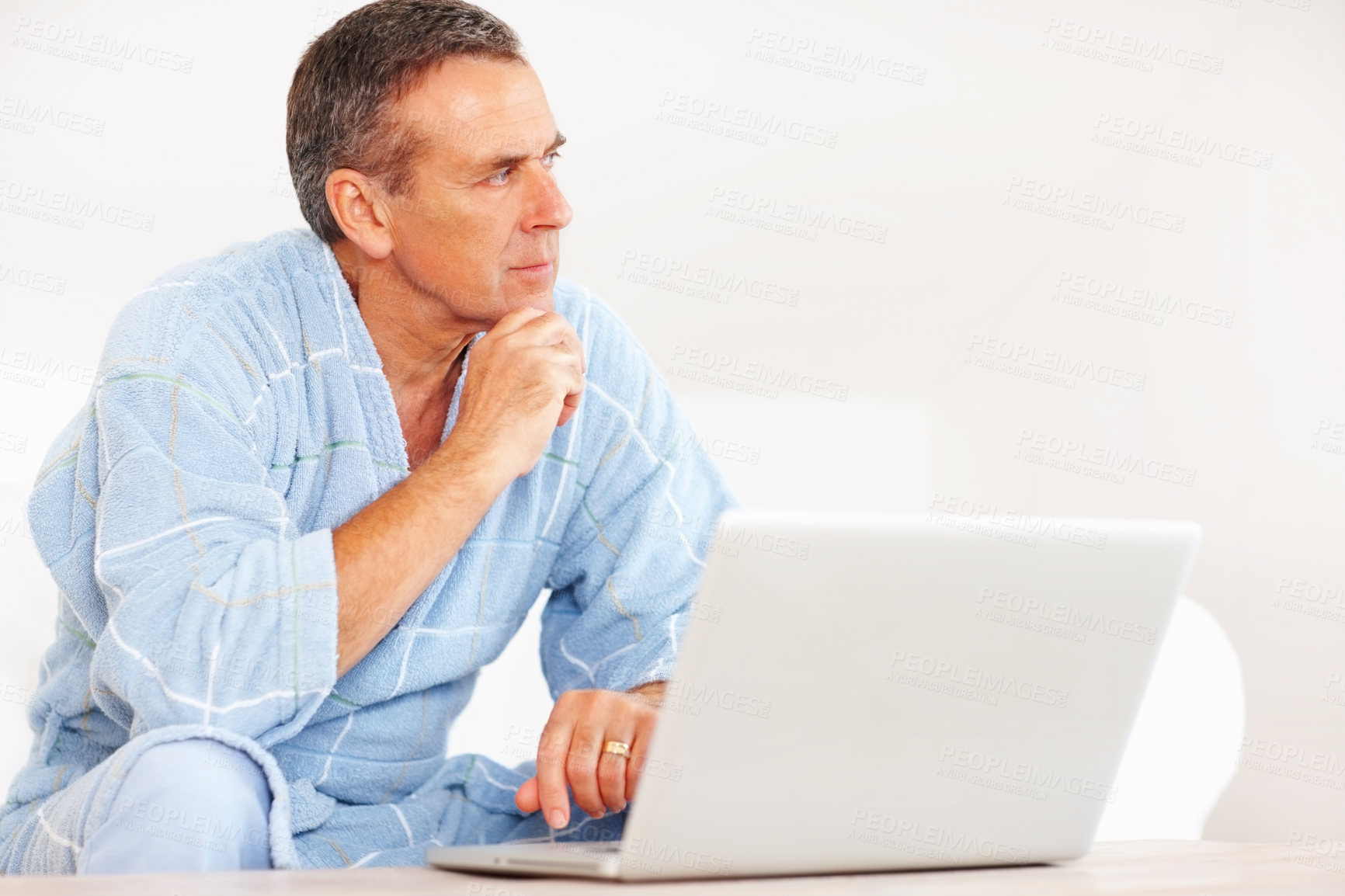 Buy stock photo Thinking, morning and mature man on laptop for email, social media or streaming subscription on sofa. Internet search, couch and senior person on computer, website or networking ideas in living room.