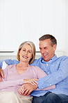 Cheerful senior man with wife having fun together - copyspace