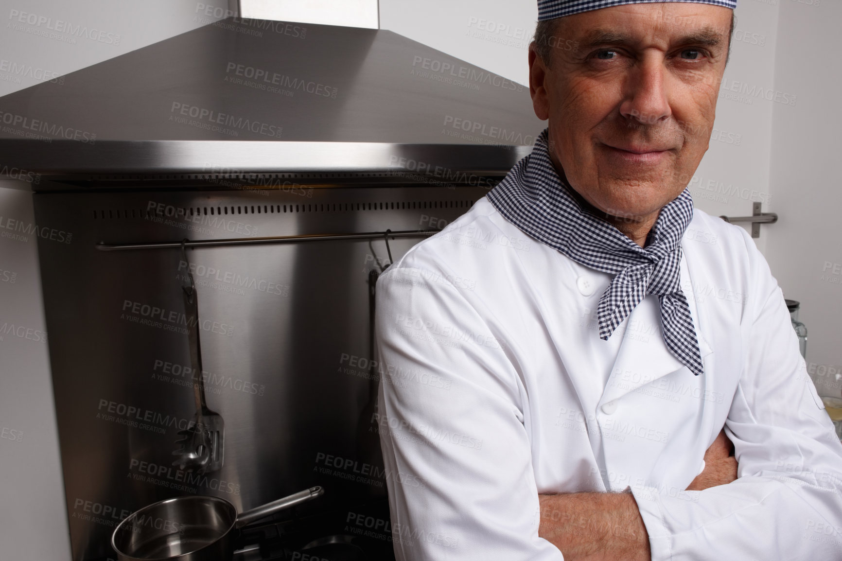 Buy stock photo Man, portrait and chef with arms crossed in kitchen for cooking, hospitality or culinary professional. Mature person, smile and confidence at hotel restaurant for dinner cuisine, menu or service