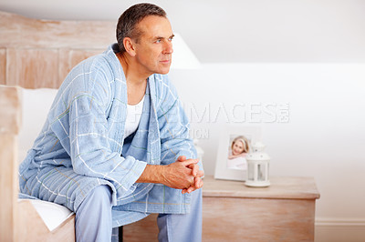 Buy stock photo Thinking, relax and mature man in bedroom at nursing home for dementia symptoms with treatment. Illness, memory loss and senior male person with reflection for past on bed at house in Australia.