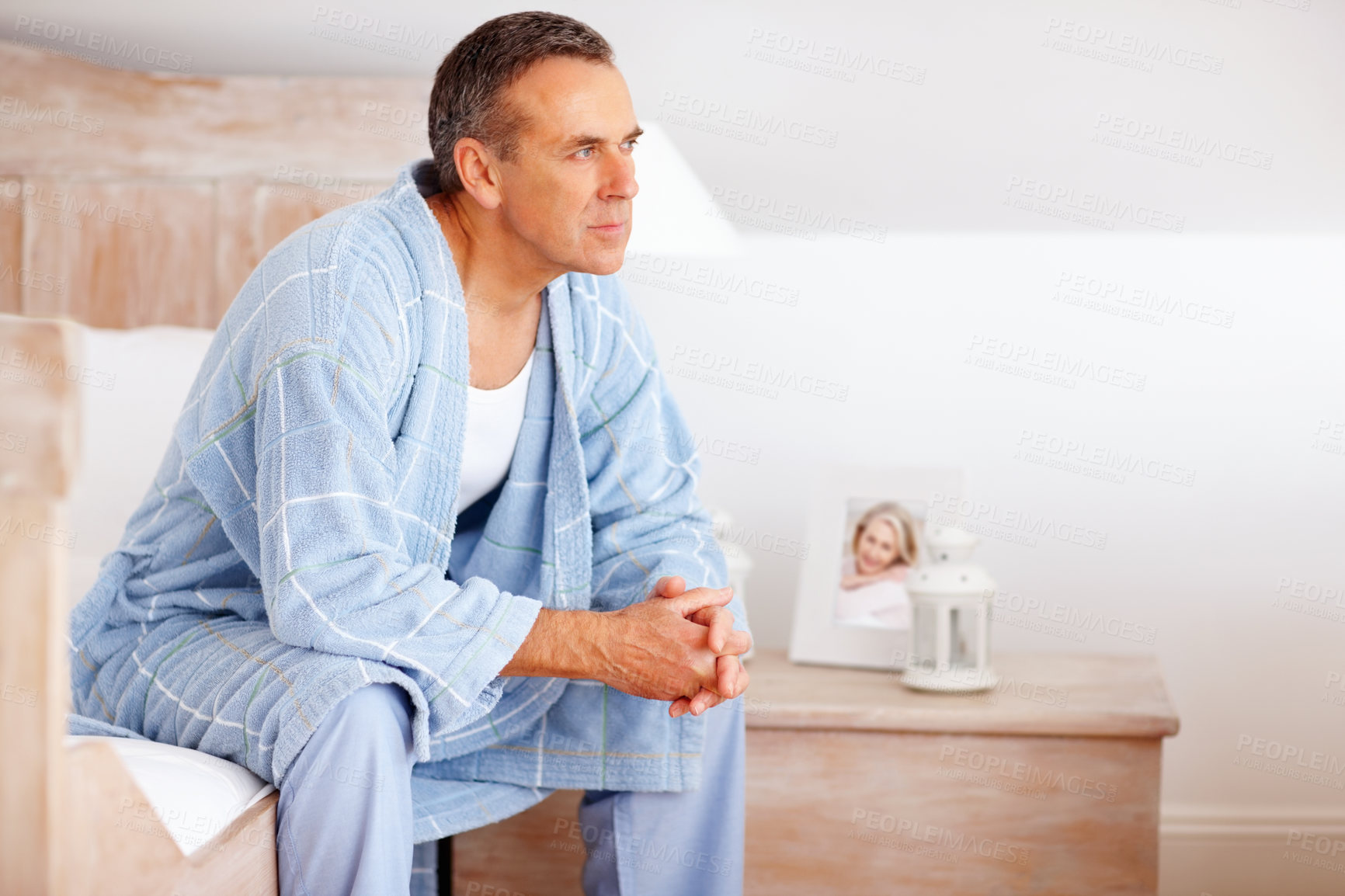 Buy stock photo Thinking, relax and mature man in bedroom at nursing home for dementia symptoms with treatment. Illness, memory loss and senior male person with reflection for past on bed at house in Australia.