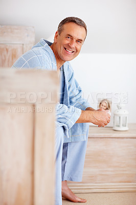 Buy stock photo Smile, portrait or elderly man in bedroom for peace, weekend relax or happy in dream home. Retirement success, senior person or calm in morning for financial security, good health or rest in Canada