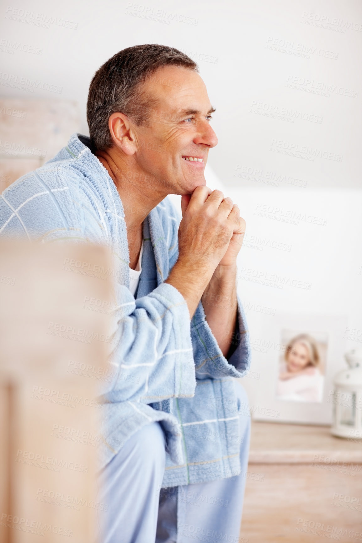 Buy stock photo Thinking, smile and mature man in bedroom at nursing home for  symptoms with treatment. Relax, happiness and idea with senior male person with reflection for past on bed at house in Australia.