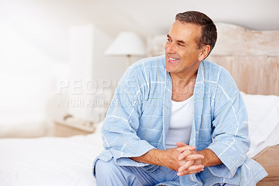 Buy stock photo Mature man, happy and relax on bed at hotel for retirement, thinking and wellness while on holiday. Home, smile and calm in lodge bedroom for break or idea on weekend while on vacation with peace