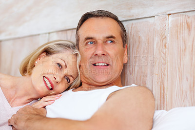 Buy stock photo Mature couple, portrait and smile on bed at house for relax, love and retirement together with trust and care. Man, woman and happy in hotel room for marriage, loyalty or tired on weekend with hug