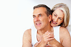 Romantic couple smiling against white background - copyspace