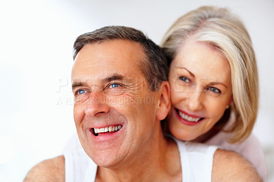 Buy stock photo Senior, laughing or happy couple embrace in house bedroom together to relax on holiday for bonding or support. Hug, funny or romantic man and mature woman with love, smile or care on white background