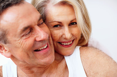 Buy stock photo Portrait smile, mature couple and hug for healthy relationship, bonding and support with care in home. Happy woman, man and love embrace with safety for trust, calm weekend and marriage commitment