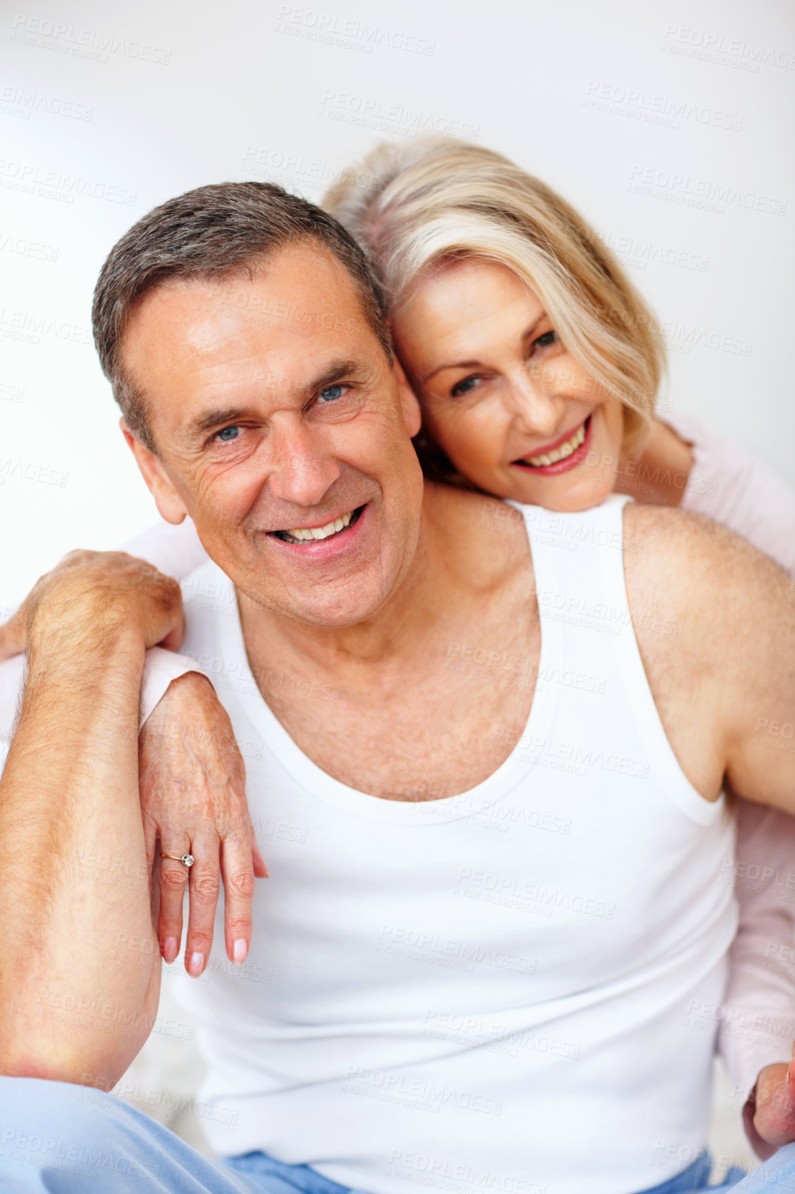 Buy stock photo Mature, happy couple portrait and hug in house bedroom together to relax on holiday for bonding or support. Embrace, funny or romantic man and senior woman for love, smile or care on white background