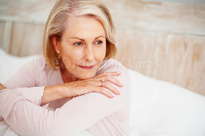 Buy stock photo Senior woman, relax and thinking in bed with mindfulness, retirement ideas and weekend in home. Elderly female person, calm thought and rest on mattress for morning peace, wellness and daydreaming