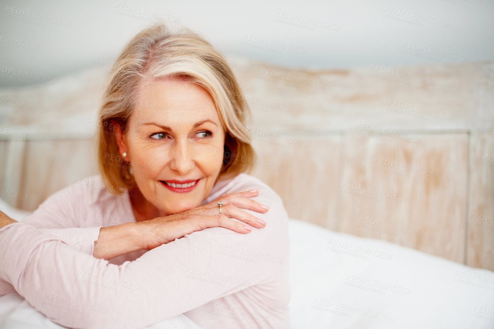 Buy stock photo Mature woman, thinking and relax on bed in hotel on holiday for retirement, leisure and wellness. Female person, idea and comfort in bedroom at lodge while on vacation for peace, health and break