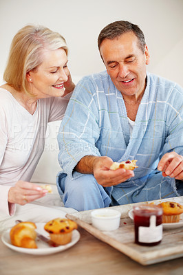 Buy stock photo Mature couple, bedroom and food for breakfast, support and nutrition for retirement health. Senior woman, man and croissant or muffin with fruit jam for diet, romance and elderly wellness or hotel