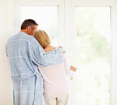 Buy stock photo Senior couple, back and hug with love relationship, marriage and safety together in home. Man, woman and rear view embrace with support for bonding, pyjama clothes and morning peace for retirement