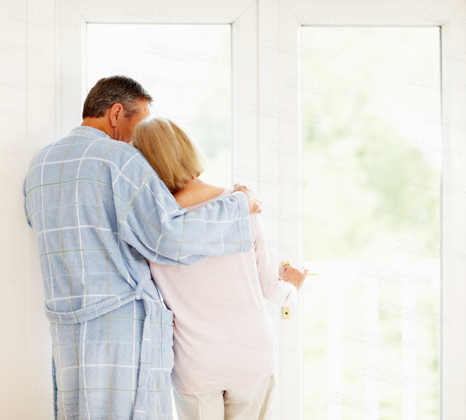 Buy stock photo Senior couple, back and hug with love relationship, marriage and safety together in home. Man, woman and rear view embrace with support for bonding, pyjama clothes and morning peace for retirement