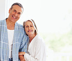 Mature couple spending time together against colored background