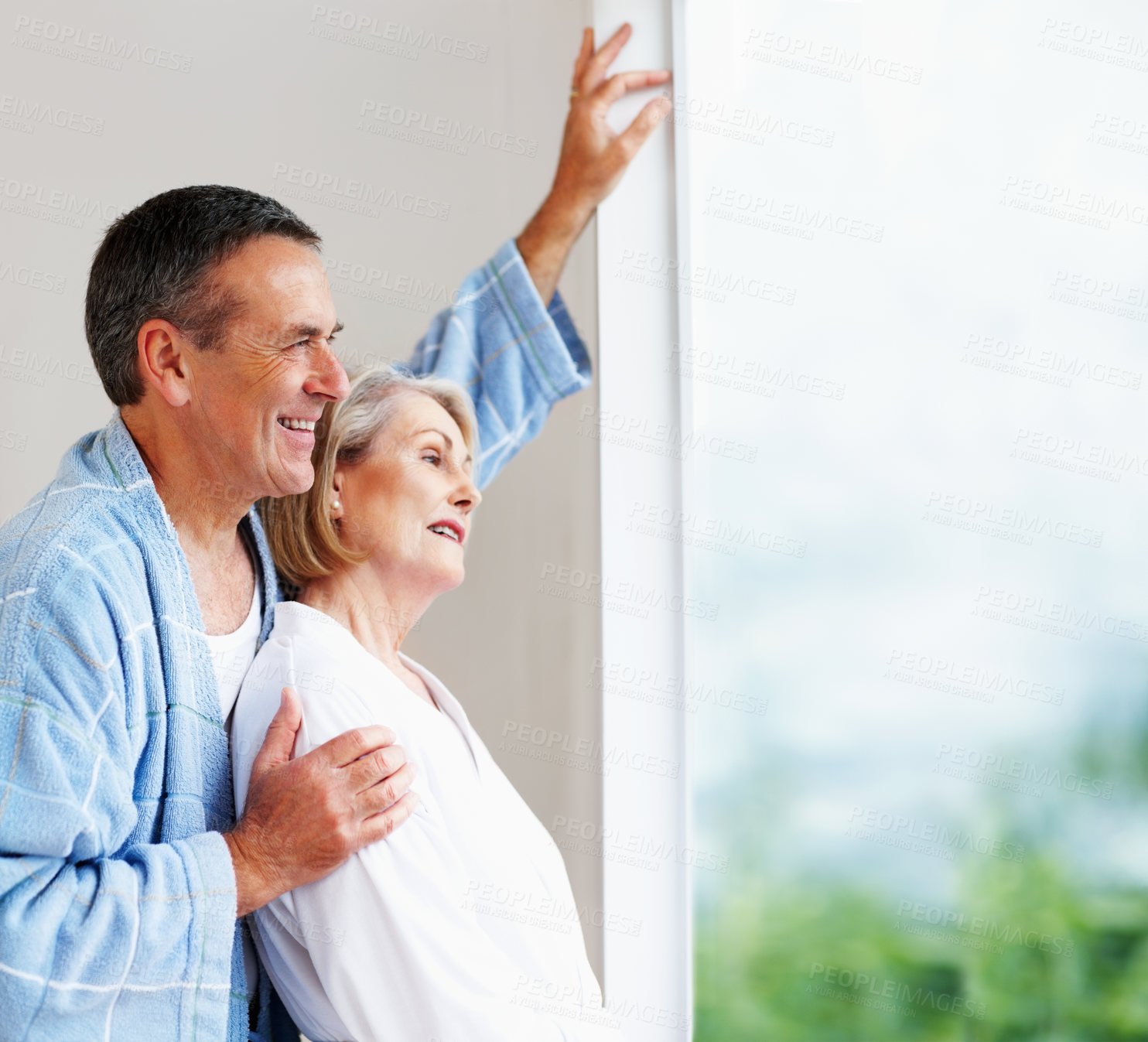 Buy stock photo Mature couple, window and hug in house in morning for retirement, leisure and wellness with bonding. Man, woman and anniversary celebration at hotel with smile or trust for peace, health and love