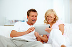 Cute couple using tablet pc