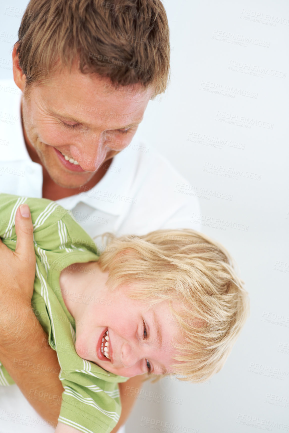 Buy stock photo Happy, fun and father playing with child at home for bonding energy together on a weekend. Smile, positive and young dad being playful with boy kid from Australia for care and love in family house.