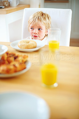 Buy stock photo Kid, breakfast and bagel at home in the morning with food, smile and happy from eating. Family, dinner table and hungry young child with meal for health and nutrition in a house with orange juice