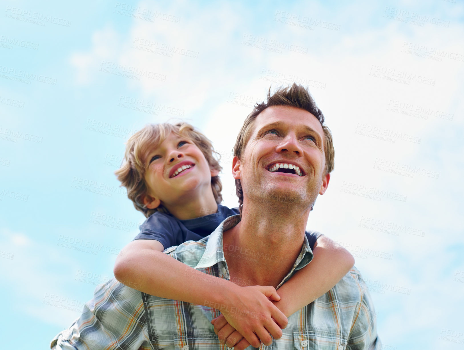 Buy stock photo Father, son and happy or blue sky with piggyback for bonding, relationship and freedom outdoor in nature. Family, man and boy child with playing, smile and love for excitement, peace and support