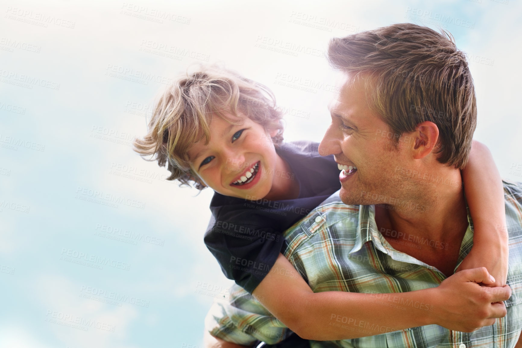 Buy stock photo Father, son and happy outdoor with piggyback for bonding, relationship and freedom with blue sky in nature. Family, man and boy child with playing, care and love for excitement, peace and support