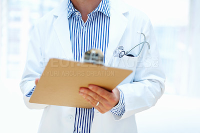 Buy stock photo Hands, clipboard and man doctor a hospital for planning, schedule or surgery checklist closeup. Healthcare, compliance and male surgeon zoom with admin for insurance, documents or results analysis