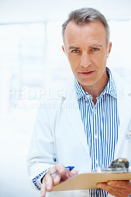 Buy stock photo Health, question and doctor with checklist on clipboard, chart or survey for insurance and medical information. Healthcare, man and portrait with paperwork, report or check up at clinic or hospital