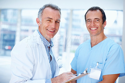 Doctor and resident smiling