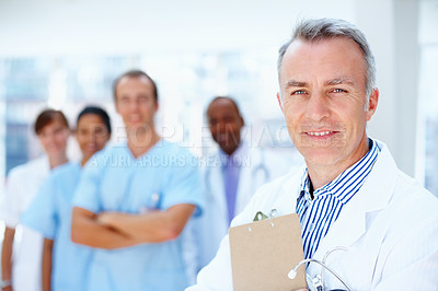 Buy stock photo Doctor, man and portrait of mentor with medical, healthcare and clinic staff in a hospital. Teamwork, expert job and stethoscope of a nurse and surgeon with professional team ready for working