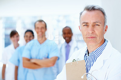 Buy stock photo Doctor, man and portrait of boss with medical, healthcare and clinic staff in a hospital. Teamwork, leadership job and management of a manager and surgeon with professional team ready for working