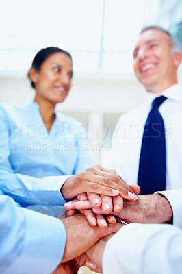 Buy stock photo Happy business people, hands together and meeting in teamwork, motivation or collaboration at office. Group of employees piling for community, diversity or support in trust or unity at workplace