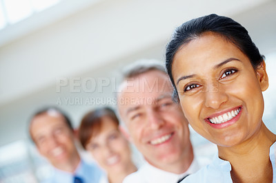 Buy stock photo Smile, portrait of business woman with team in the office for positive, good and confident attitude. Happy, collaboration and professional young Indian female designer with people in workplace.