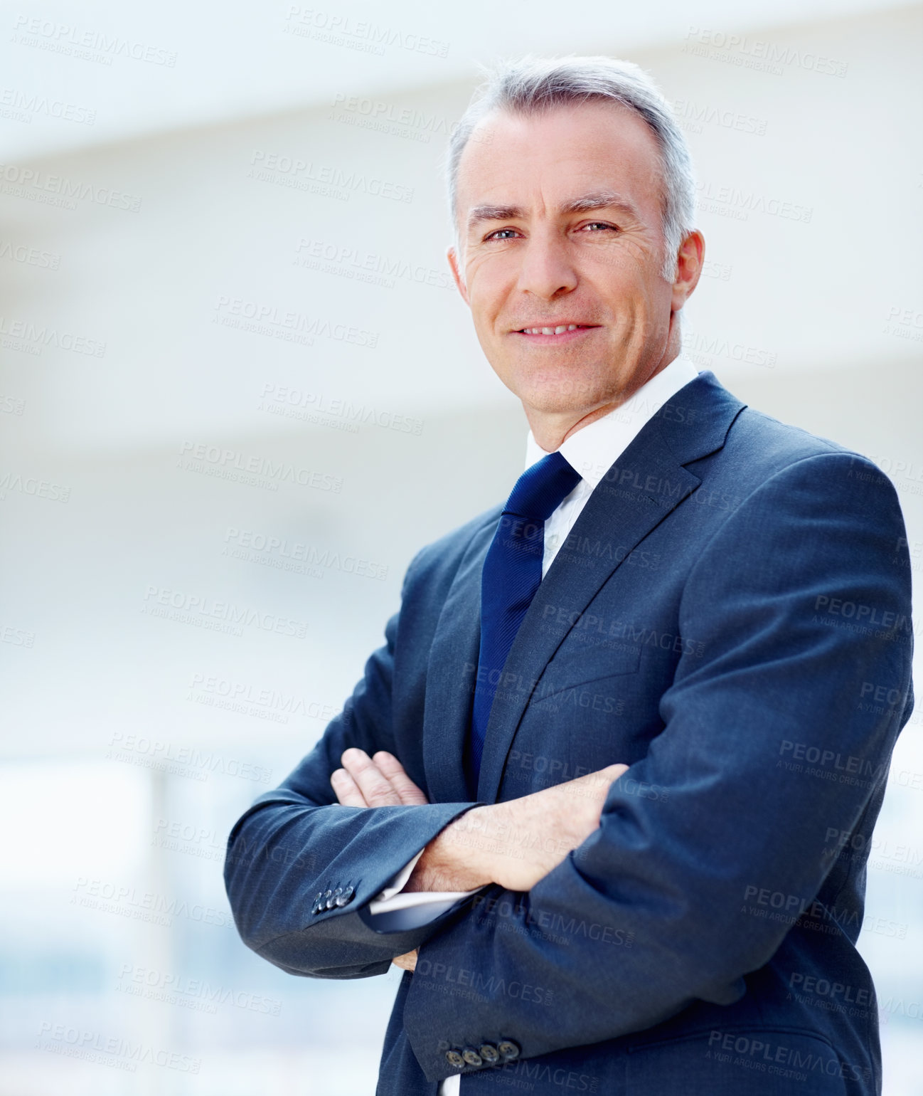 Buy stock photo Executive standing with arms folded