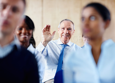 Buy stock photo Senior businessman, meeting and question in seminar for interaction or collaboration at office. Happy mature man with hands raised for answer, idea or solution in team conference or staff training