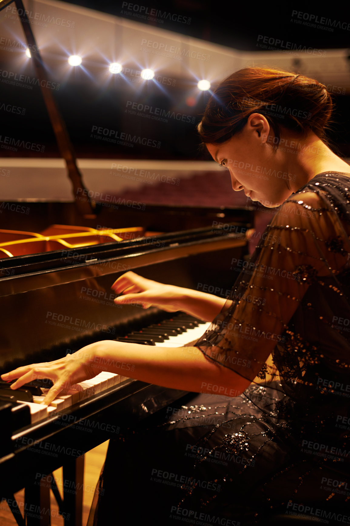 Buy stock photo Music, concert and woman with piano on a stage for performance, entertainment and talent show. Musician, creative art and person practice playing instrument for melody, classical sound and symphony