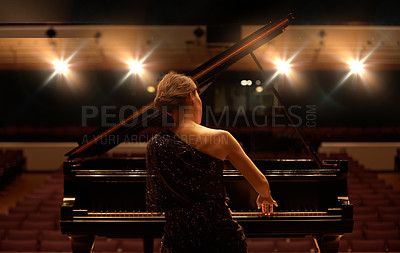 Buy stock photo Stage, concert and back of woman with piano for performance, entertainment and talent show. Musician, pianist and person practice playing on instrument for melody, music and symphony for theatre