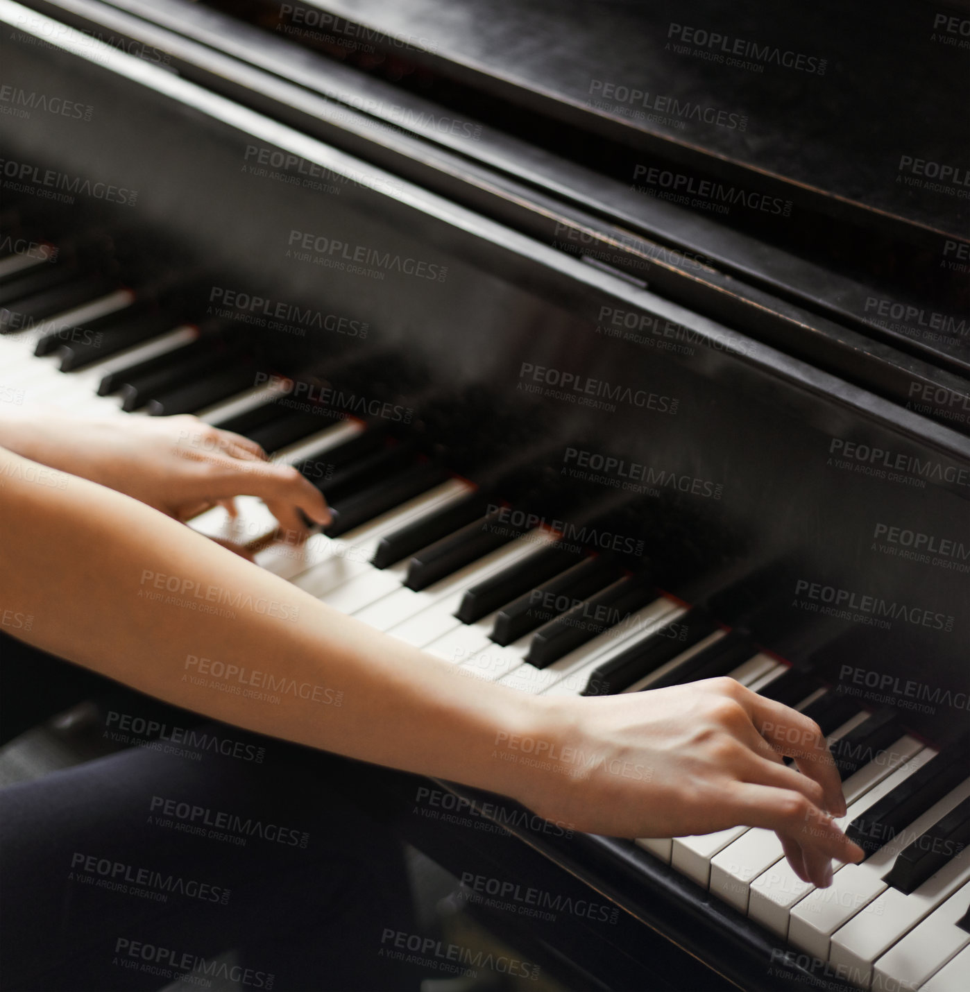 Buy stock photo Cropped shot of hands on piano keys