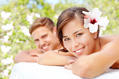 Buy stock photo Massage, relax and portrait of happy couple at spa outdoor for skincare, health or wellness. Face, man or woman at luxury salon with hibiscus flower in nature for therapy on romantic holiday together