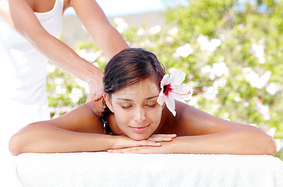 Buy stock photo Back massage, flower and woman at spa for health, skincare or calm for wellness outdoor. Masseuse, peace and girl at luxury salon with natural hibiscus for therapy service, relax and beauty treatment