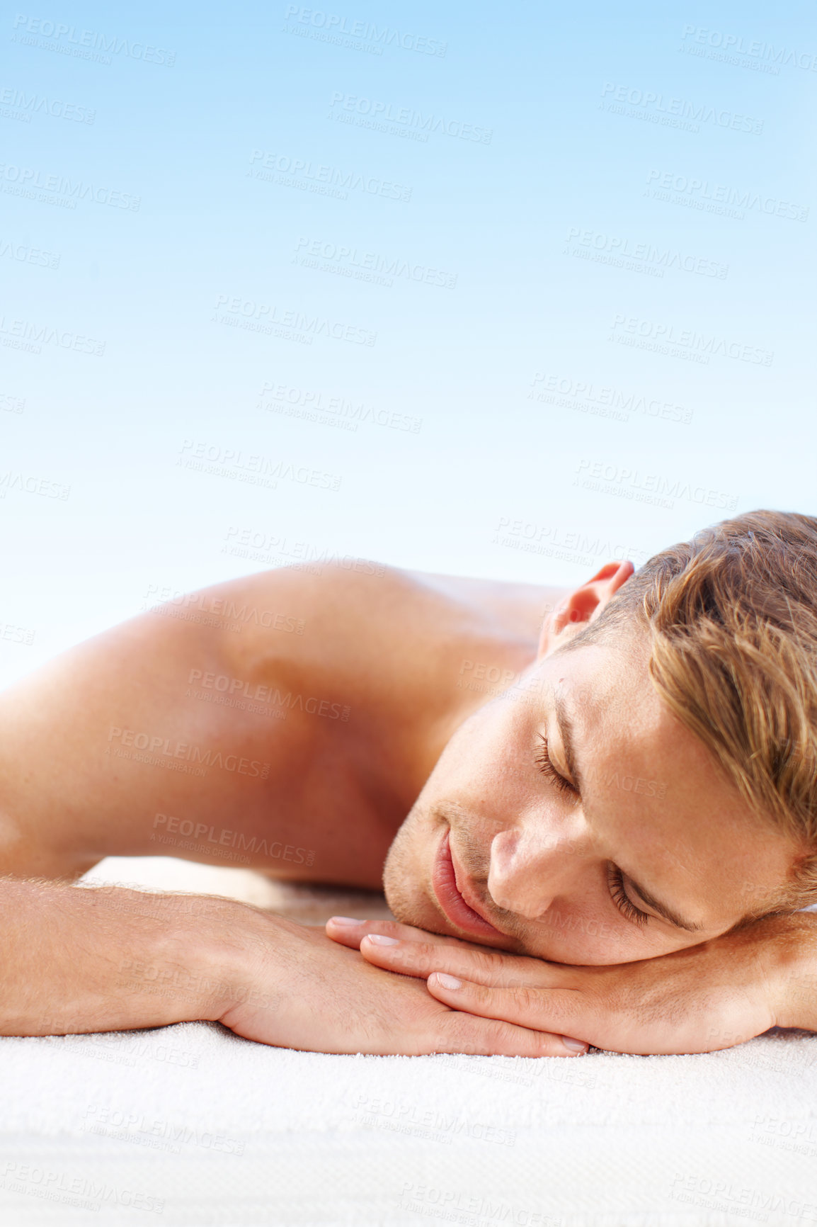 Buy stock photo Massage, relax and man in spa, sleeping and ready for luxury, towel and hotel, vacation and wellness. Holiday, guy and rest by mockup, treatment and stress free with nap and person in Hungary