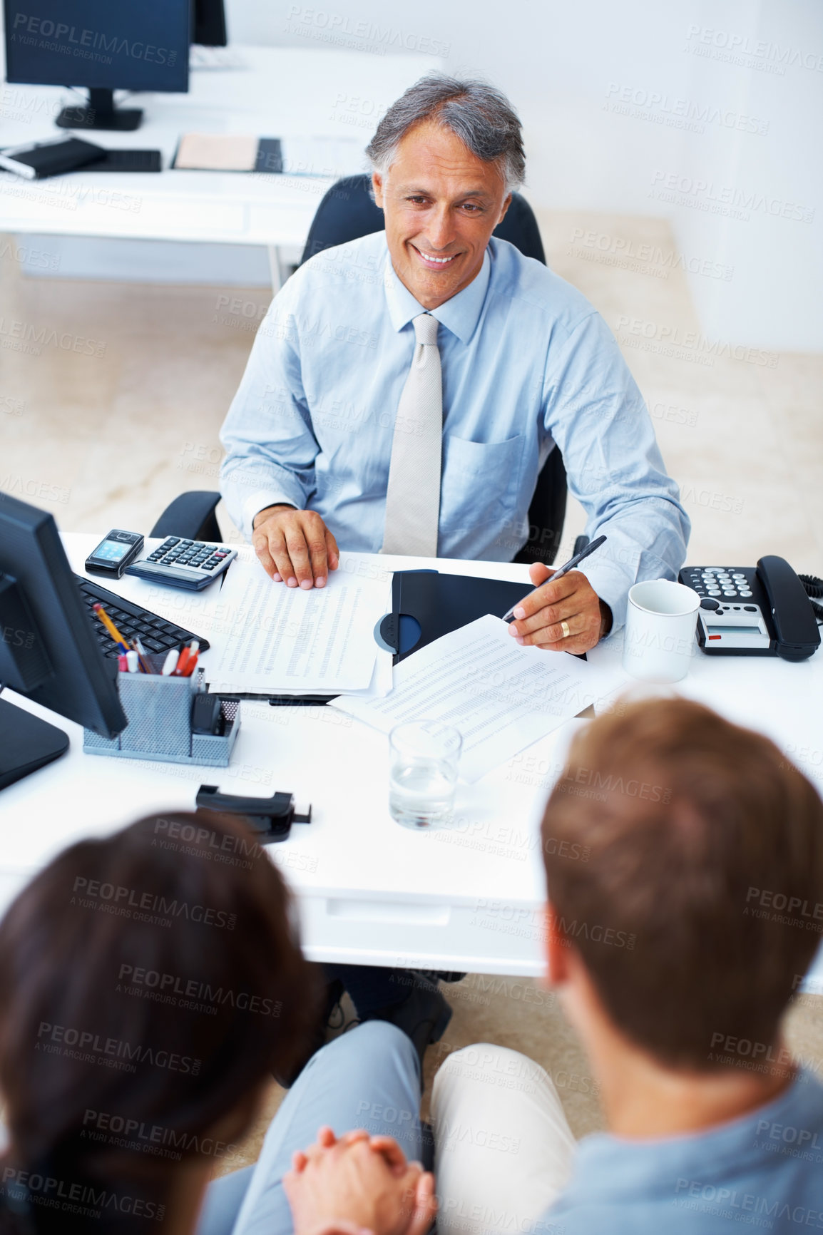 Buy stock photo High angle view of financial advisor meeting couple in office
