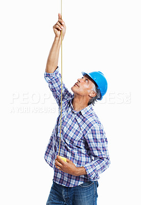 Buy stock photo Mature architect in hardhat using measure tape on white background