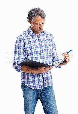 Buy stock photo Mature business man going through documents over white background