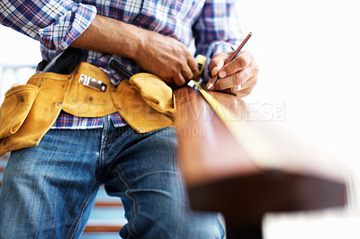 Buy stock photo Closeup of architect measuring wood with tape