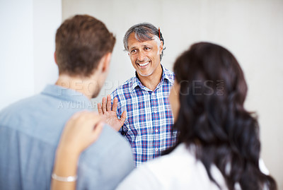 Buy stock photo Mature engineer discussing home renovation plan with couple