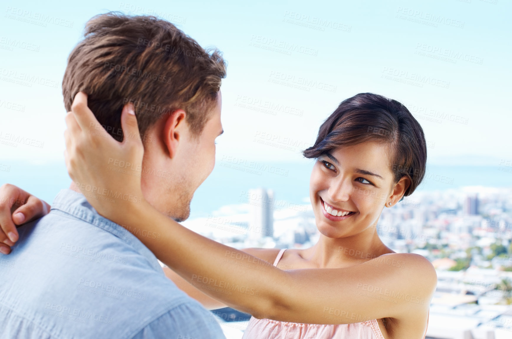 Buy stock photo Rooftop, couple and happy with hug for bonding with love, trust and support in Spain. People, relationship and smile in outdoor for care on holiday or vacation for honeymoon, relax and break for fun